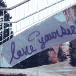 Love yourself graffiti on stairs