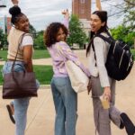 3 young females celebrating college